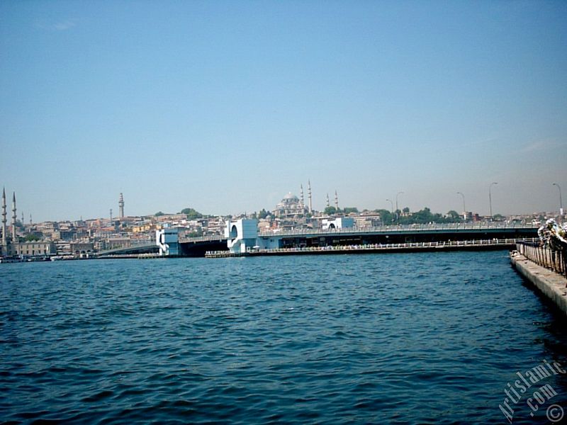 View of Eminonu coast, Yeni Cami (Mosque), (at far behind) Beyazit Mosque, Beyazit Tower, Galata Brigde and Suleymaniye Mosque from Karakoy jetty in Istanbul city of Turkey.

