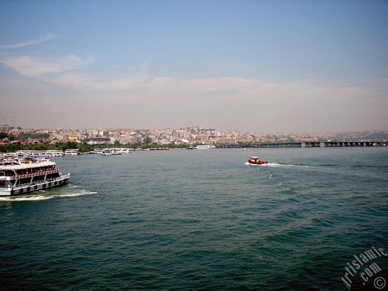 View of Sarachane coast, on the horizon on the left Fatih Mosque and in the middle Yavuz Sultan Selim Mosque from Galata Bridge located in Istanbul city of Turkey.
