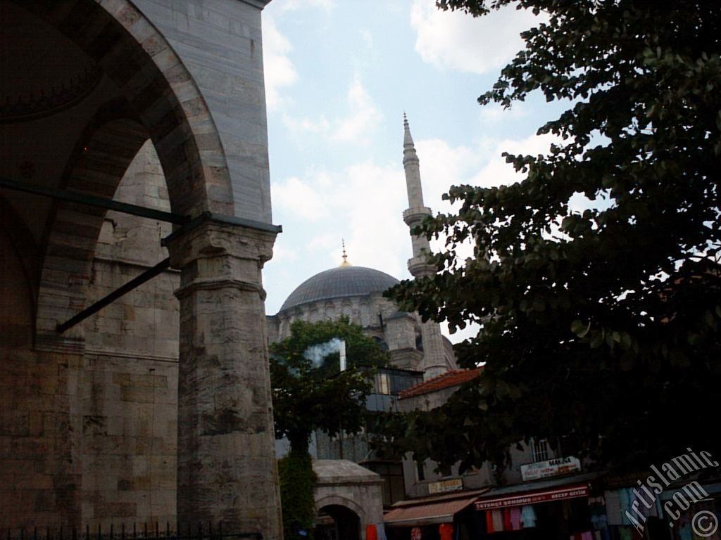 View of Nuruosmaniye Mosque from Mahmut Pasha Mosque`s outside court in Beyazit district in Istanbul city of Turkey.
