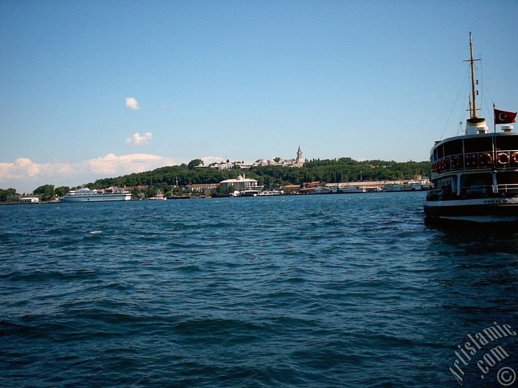 View of a ship waiting at Karakoy jetty and Topkapi Palace from the shore of Karakoy in Istanbul city of Turkey.
