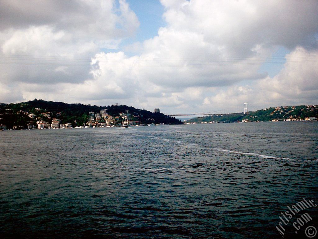 View towards Fatih Sultan Mehmet Bridge over the Bosphorus from between Arnavutkoy shore and Vanikoy shore in the middle of the Bosphorus in Istanbul city of Turkey.
